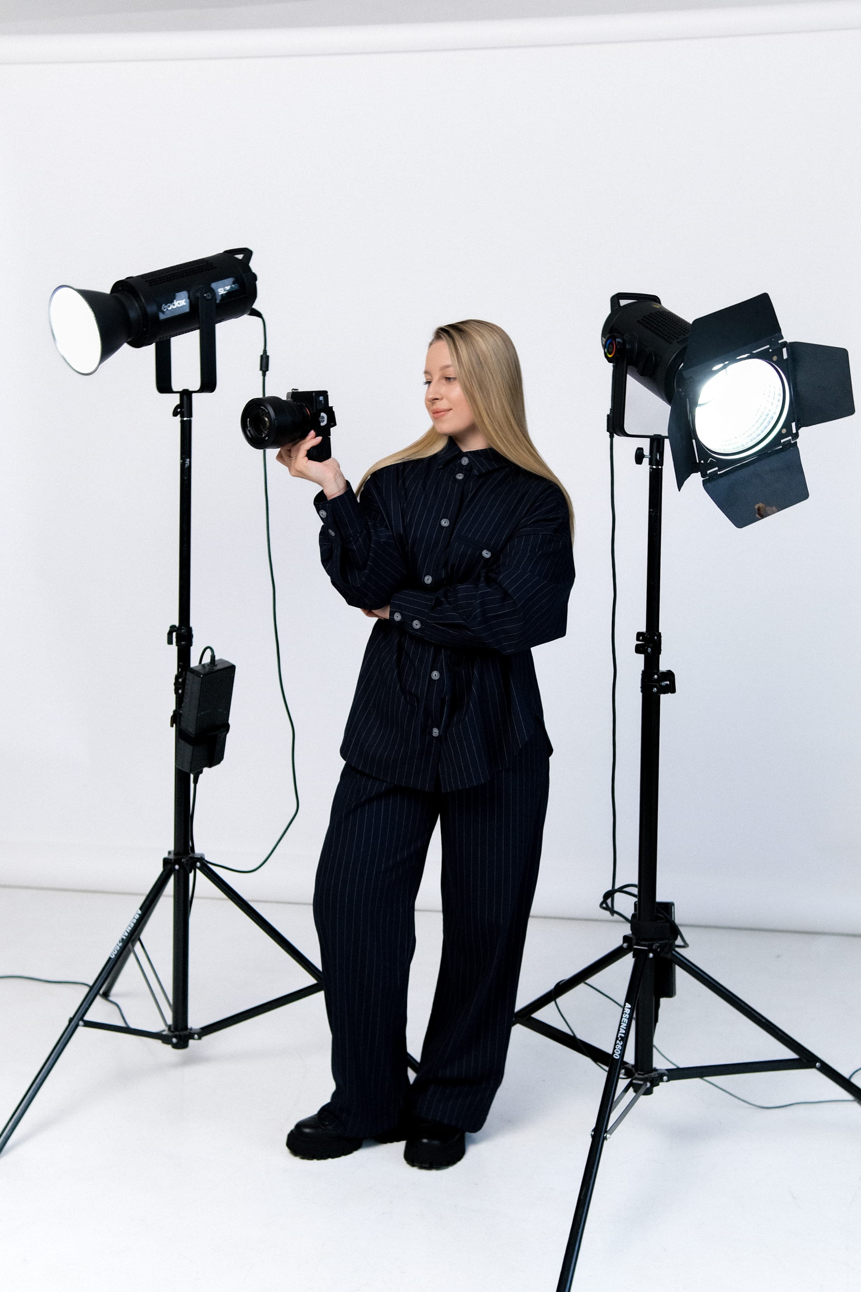 Yevheniia Humanenko in the studio, camera in hand